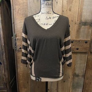 Cute winged arm top by Red Haute.